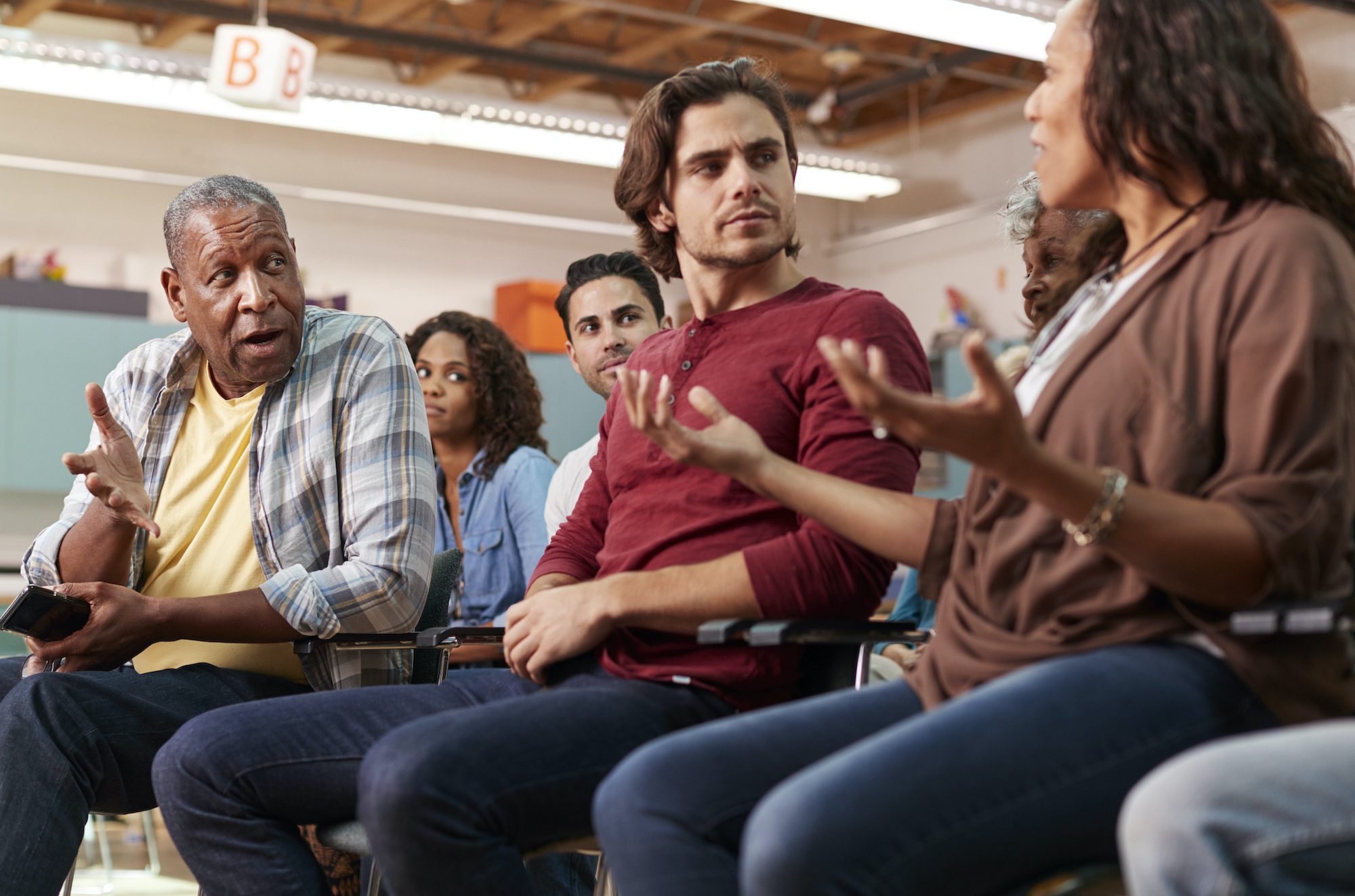 Diverse group having a tense discussion