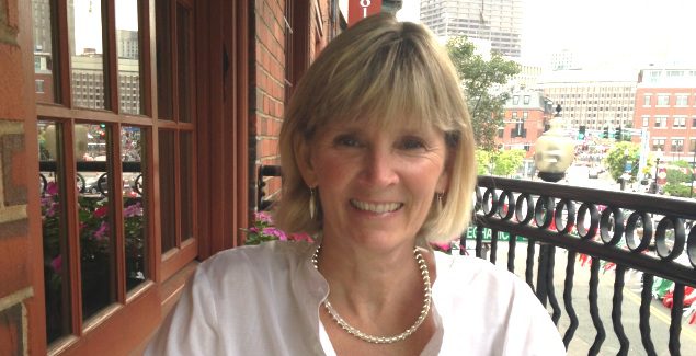 Image of Deedee sitting at an outdoor cafe in Boston