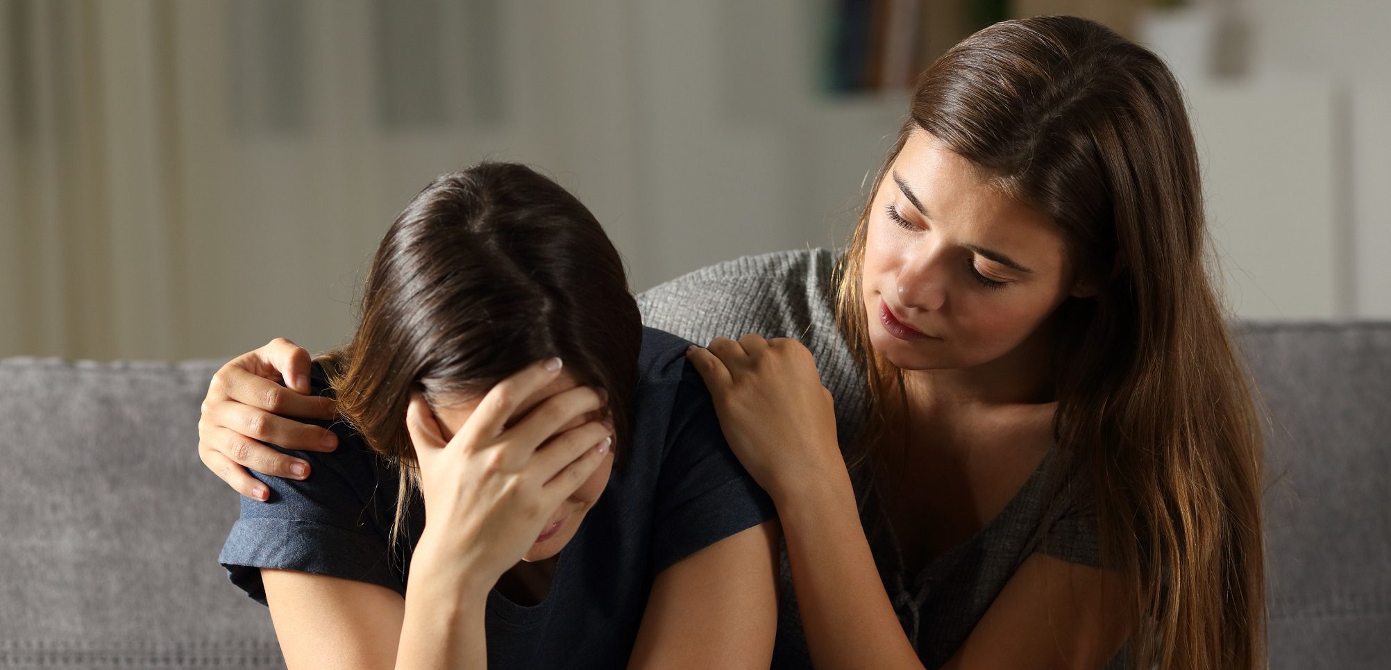 Supporting friends - Teenager comforting a friend in tears