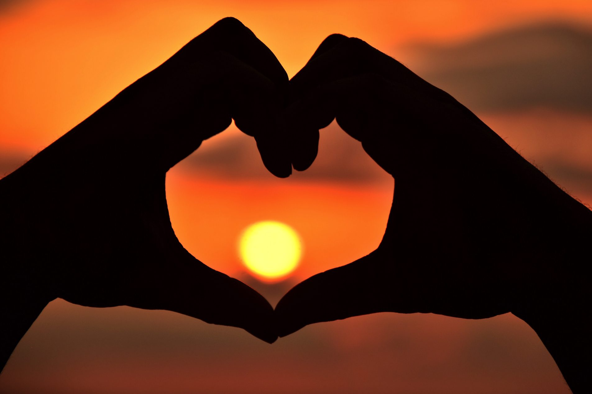 Clay Center Advisory Council - silhouette of hands making heart in front of sunset