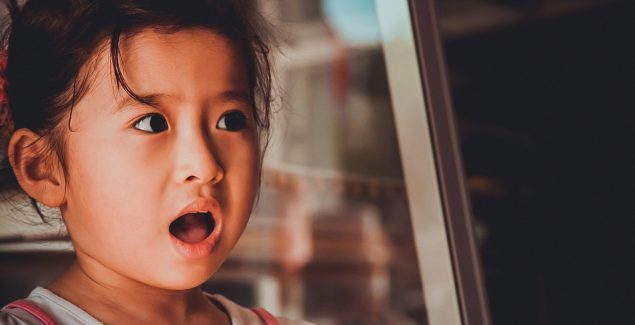 Fear of the dark - photo of young girl with a suprised expression on her face