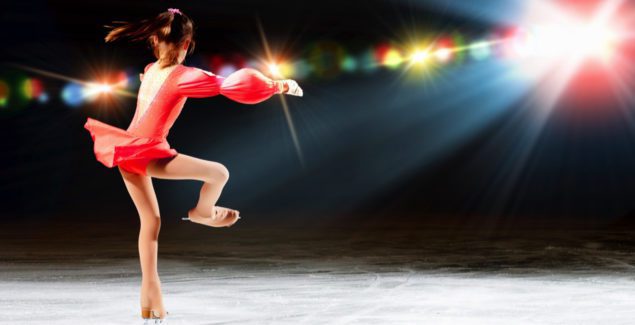 Image of a child figure skater twirling on ice during a performance