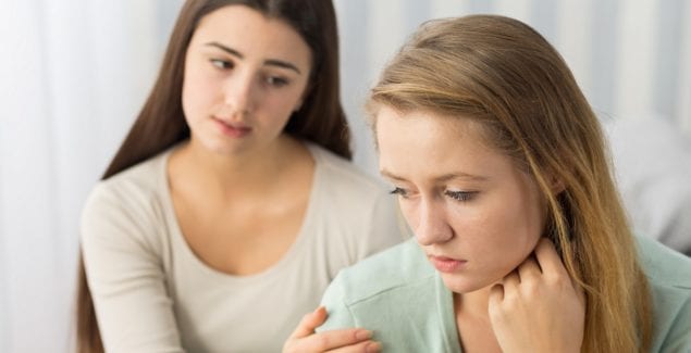 Teenager comforting her friend