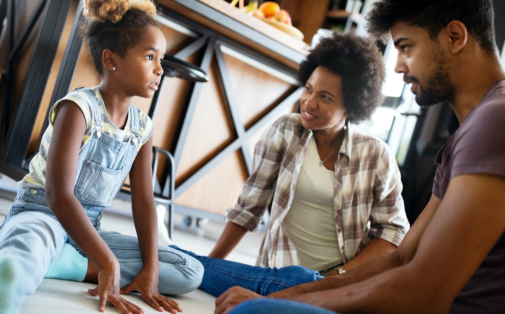 Parents having serious conversation with teenage child with problem solving attitude