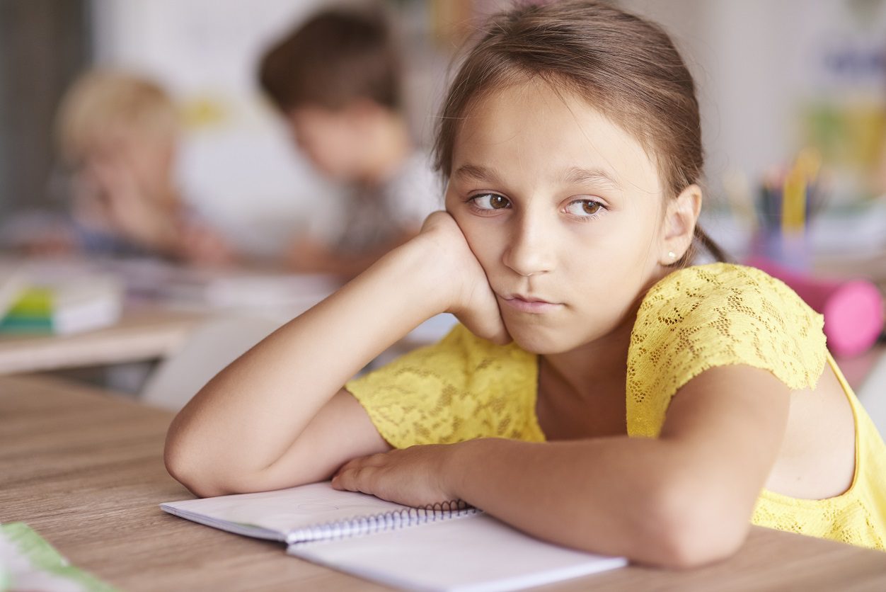 Girl sitting bored in class