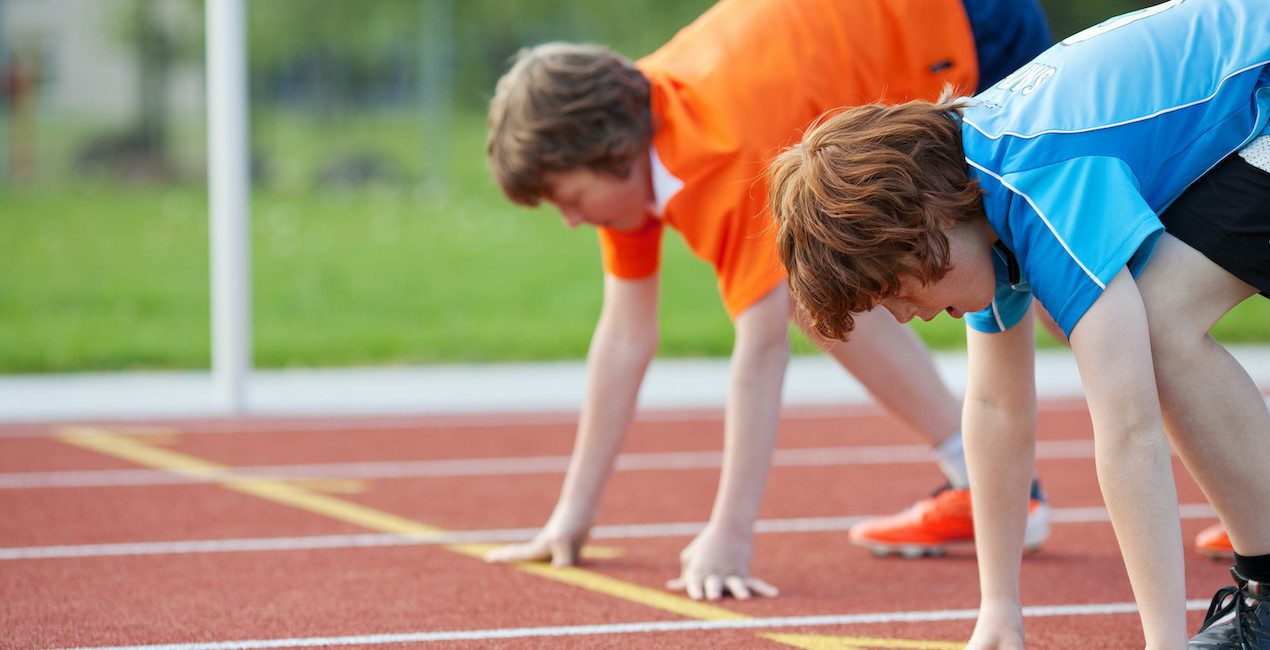 Two boys at the start line of a race