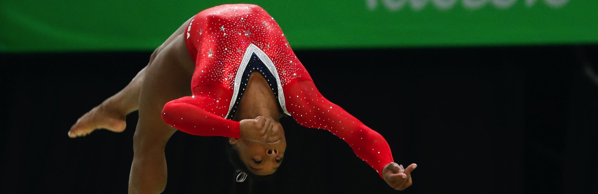 Simone Biles in mid-air competition at 2016 Rio Olympics