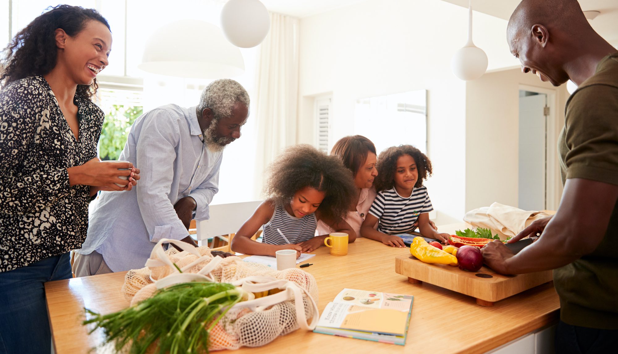 Parents, grandparents, and children gathering in the kitchen