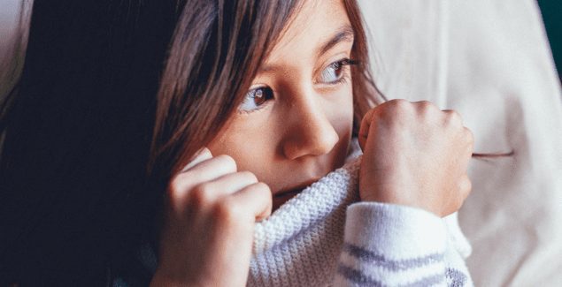 Generalized Anxiety Disorder - Anxious child looking out of the window