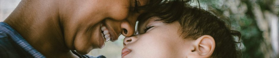 close up of mother smiling forehead to forhead with her child - the will to keep going