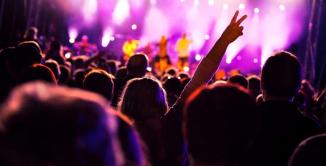 Crowds of people having fun on a music concert