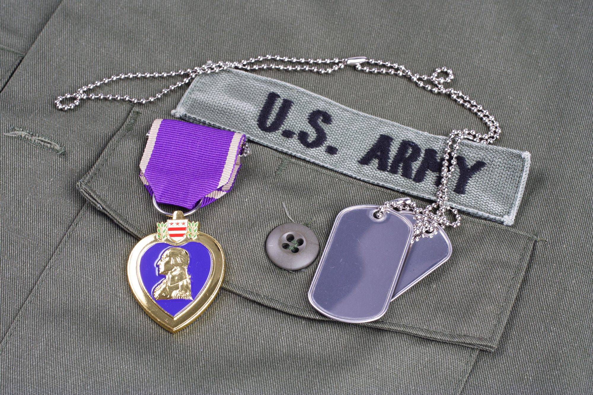 Purple Hearts - Military tags and Purple Heart award on US ARMY olive green uniform