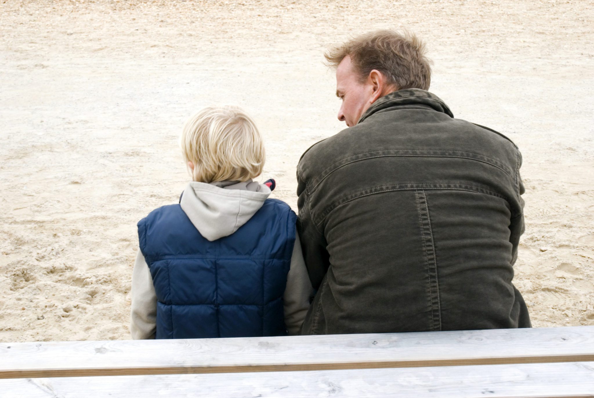 Father and son sitting together