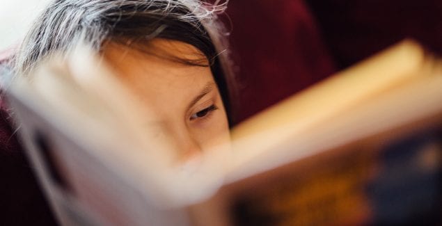 About Dyslexia - young girl reading a book