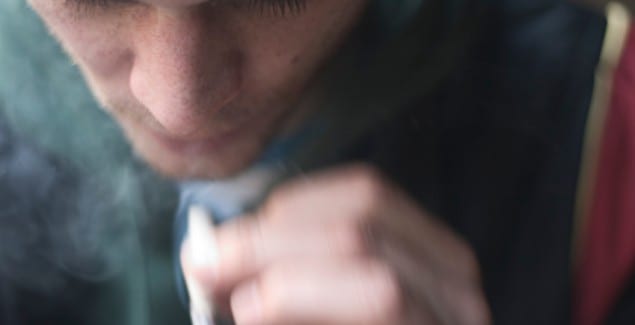 Marijuana, Ben's Story - Blurry close up image of teen smoking a joint