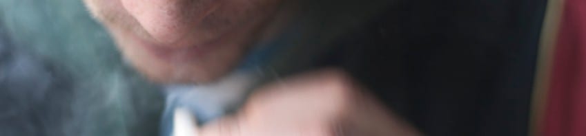 Marijuana, Ben's Story - Blurry close up image of teen smoking a joint