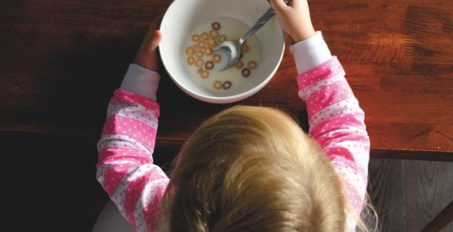 young girl eating cereal