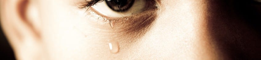 Anxiety disorder - Close up of child's eye with tear in it