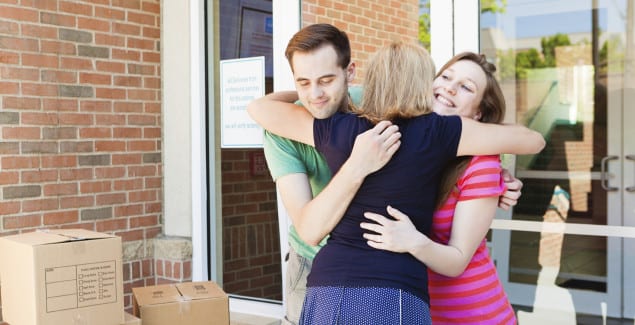 Kids leave home - Parents hugging goodbye their teenager